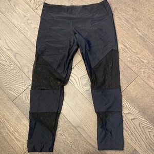 Onzie black mesh 3/4 length leggings, size M/L, in excellent condition.